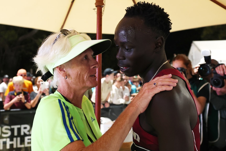 Gout Gout with his coach Di Sheppard.