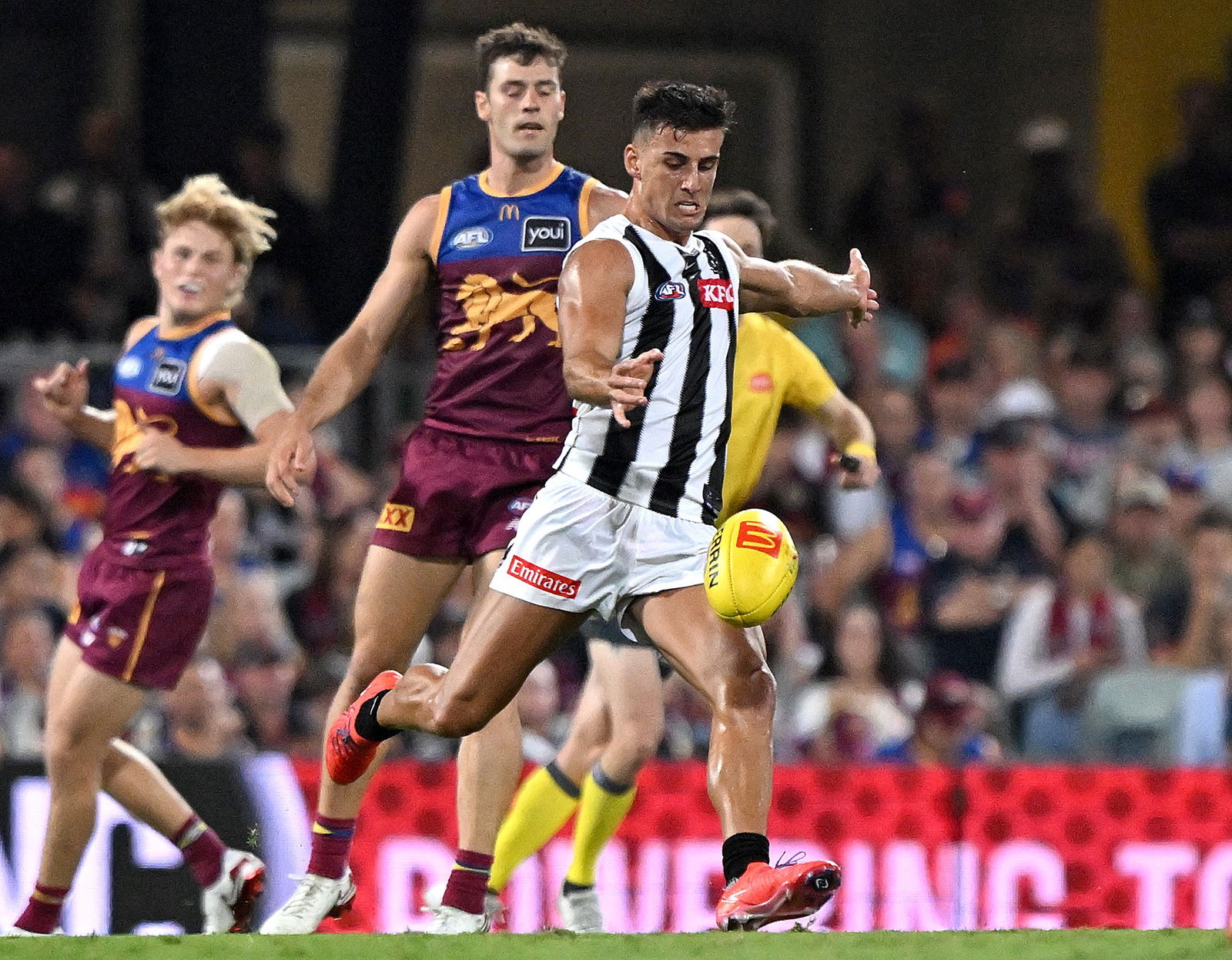 Nick Daicos kicks the ball