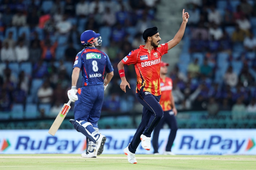 Arshdeep Singh celebrates the wicket of Mitch Marsh