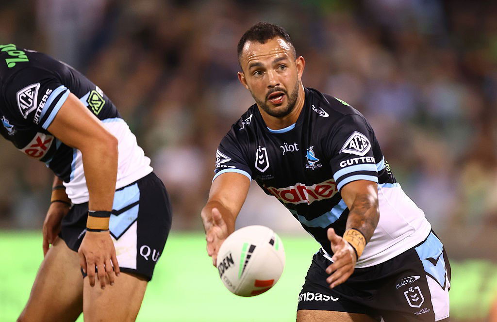 Braydon Trindall passes the ball while playing for the Cronulla Sharks in the NRL.