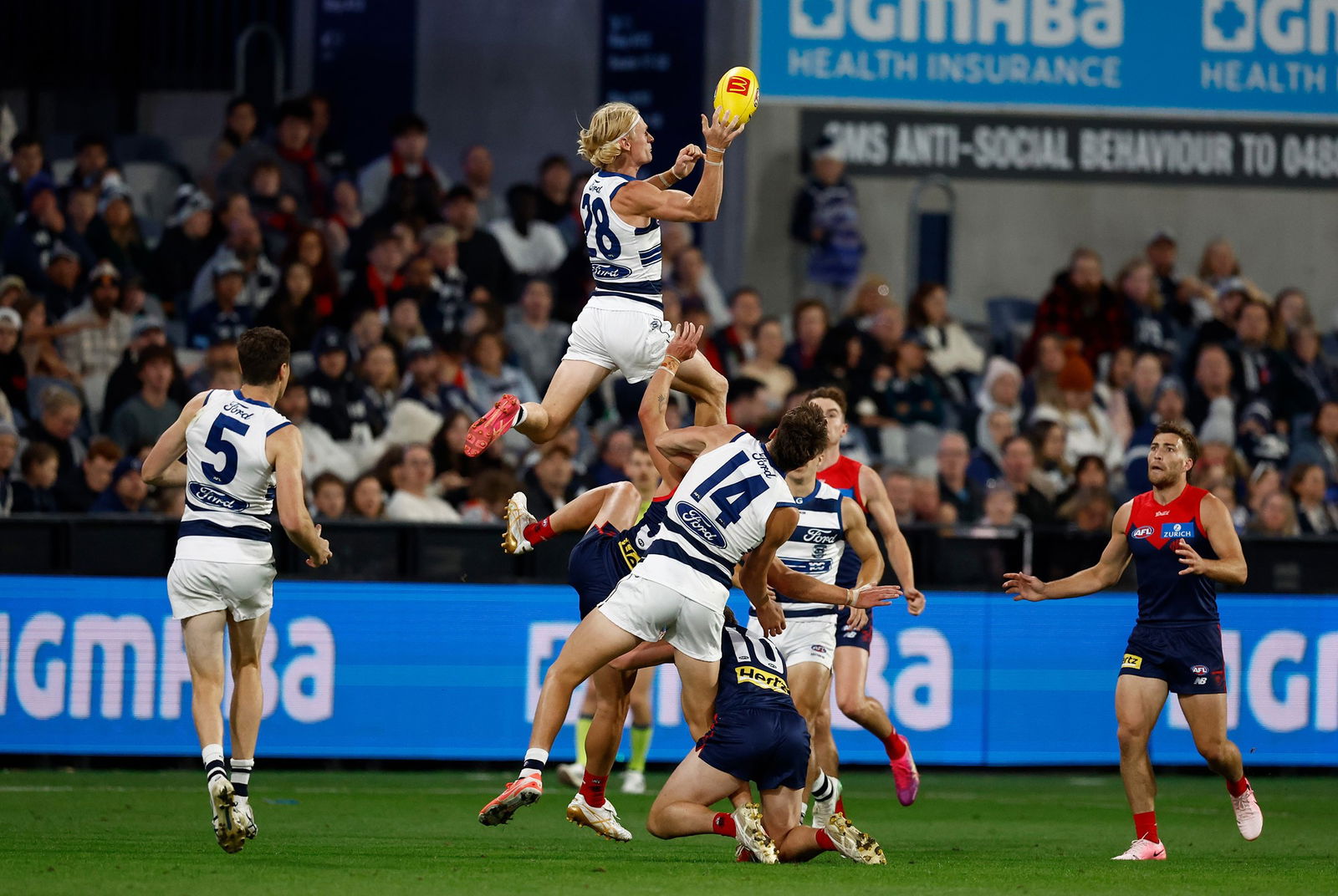 Ollie Dempsety flies for a mark