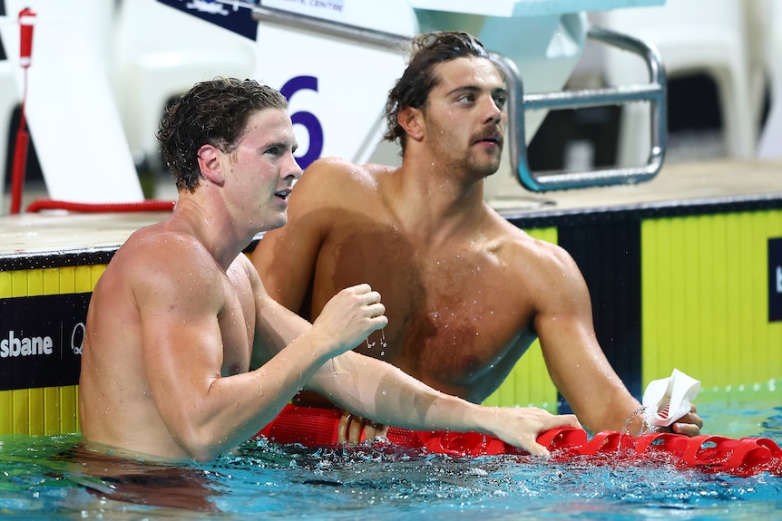 Two male swimmers in a pool.