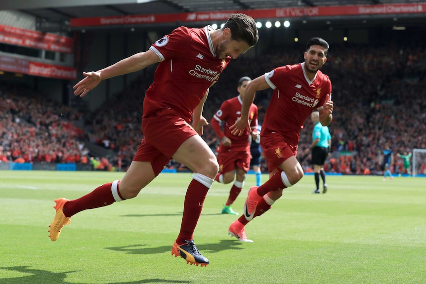 Adam Lallana celebrates a goal for Liverpool