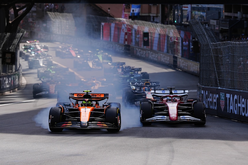 McLaren's Lando Norris locks up into the first corner