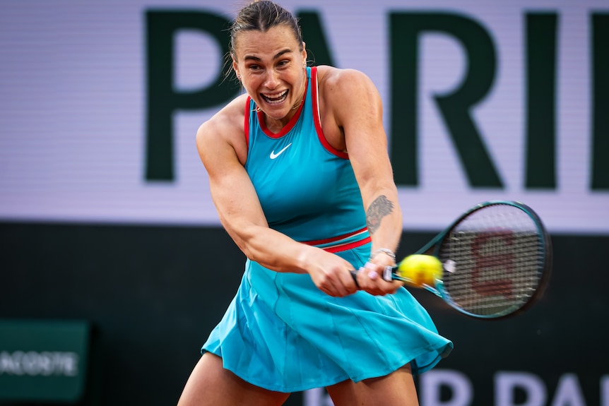 Aryna Sabalenka plays a double-fisted backhand at French Open.