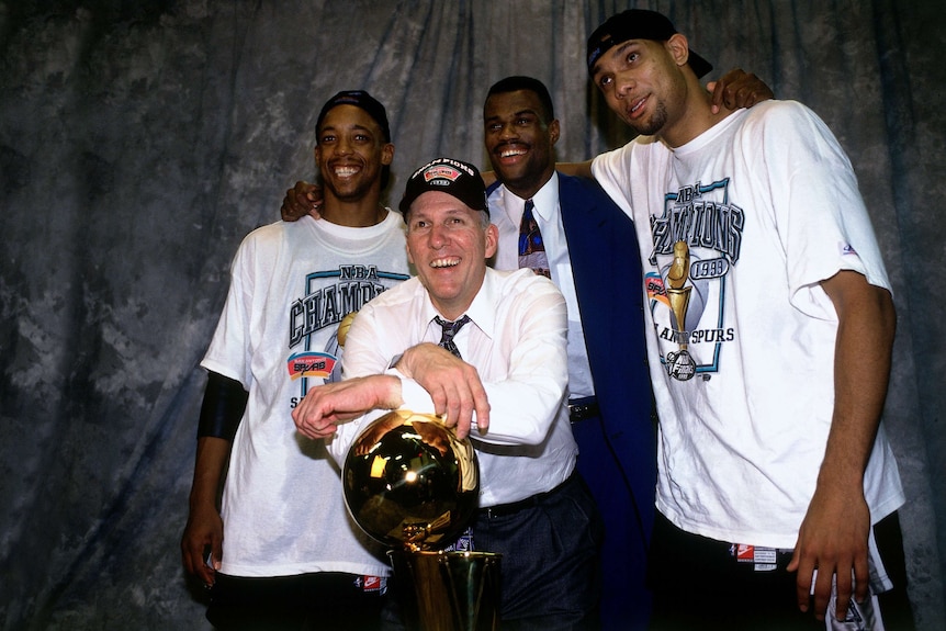 Gregg Popovich with players after winning the 1999 NBA Championship.