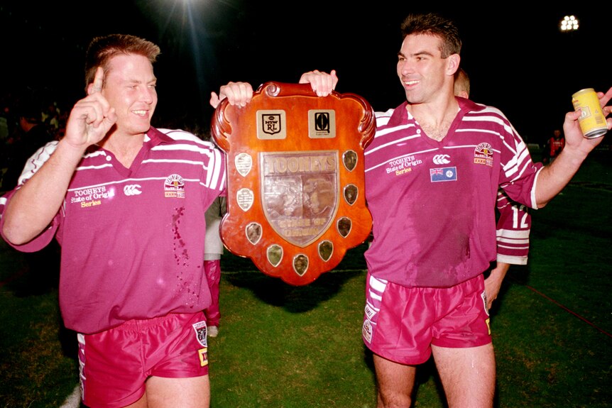 Jason Smith and Danny Moore hold the State of Origin shield in 1995.