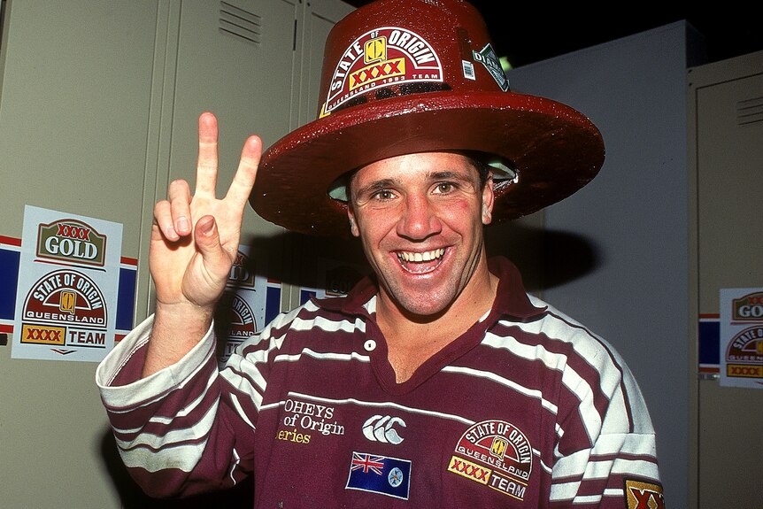 A man celebrates winning a game of rugby league 