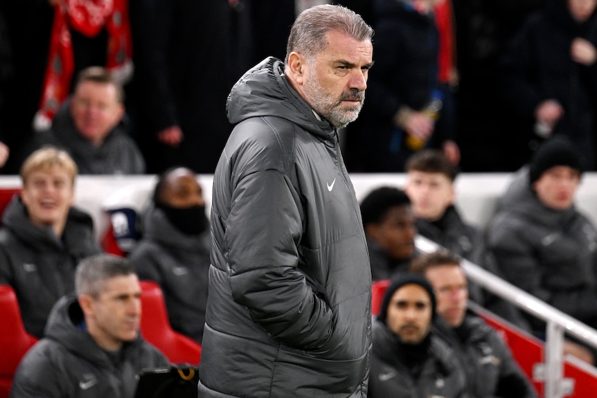 Ange Postecoglou looks on during second leg of Tottenham's League Cup semifinal against Liverpool.