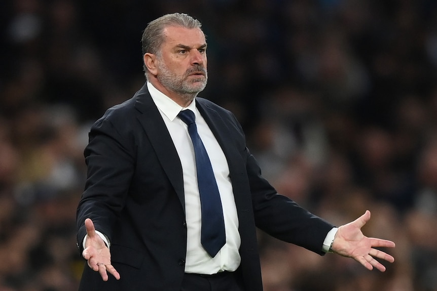 Ange Postecoglou looks annoyed with his arms out