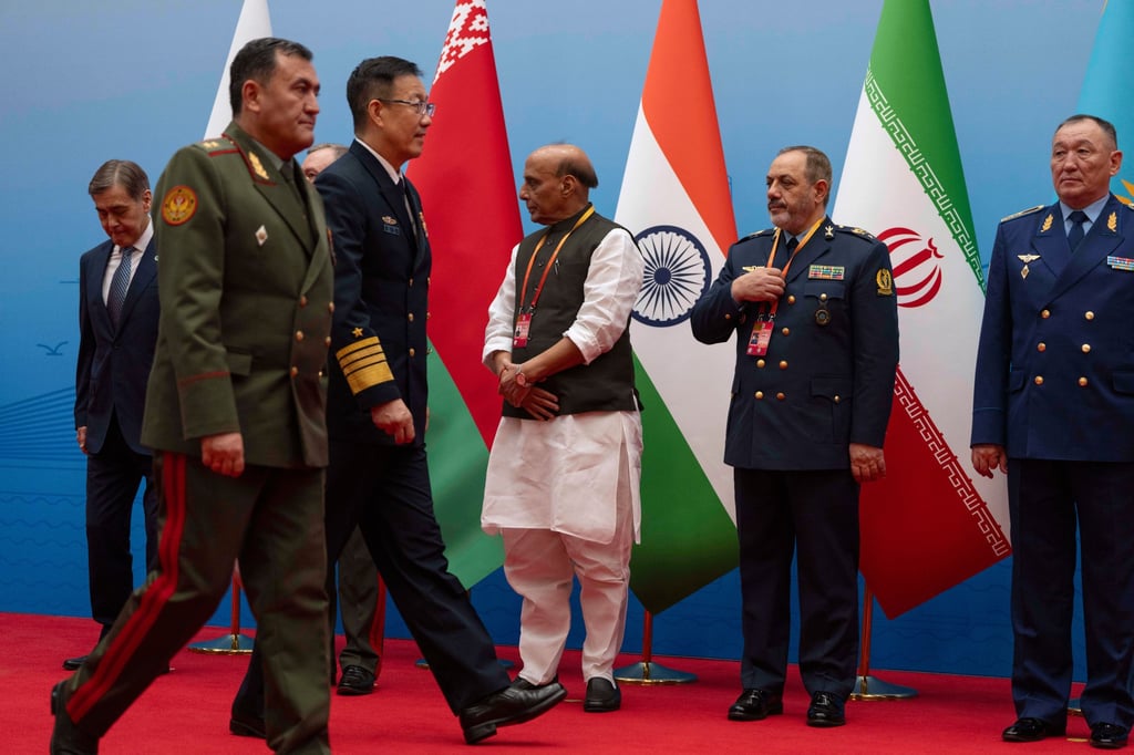 Chinese Defense Minister Dong Jun walks near Iran Defence Minister Aziz Nasirzadeh, second right, as they attend a group photo ahead a Shanghai Cooperation Organisation meeting in Qingdao on Thursday. Photo: AP