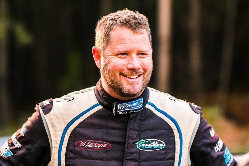 A man in a race suit.