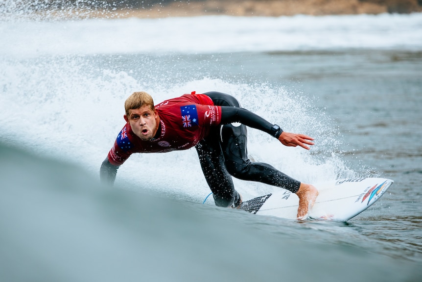Surfer Mick Fanning riding a wave during the final of a tournament