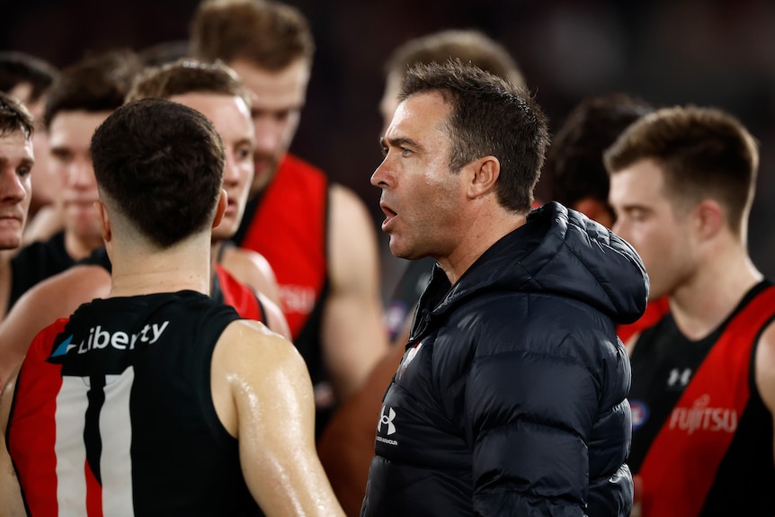 Brad Scott relays a message to Essendon's players