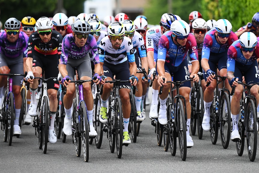 Ben O'Connor rides at the front of the peloton
