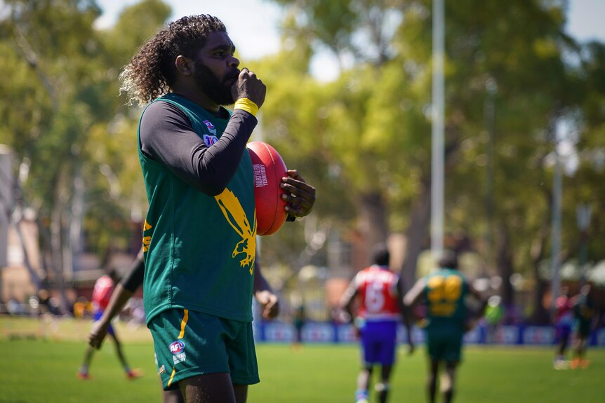 A man on a footy oval