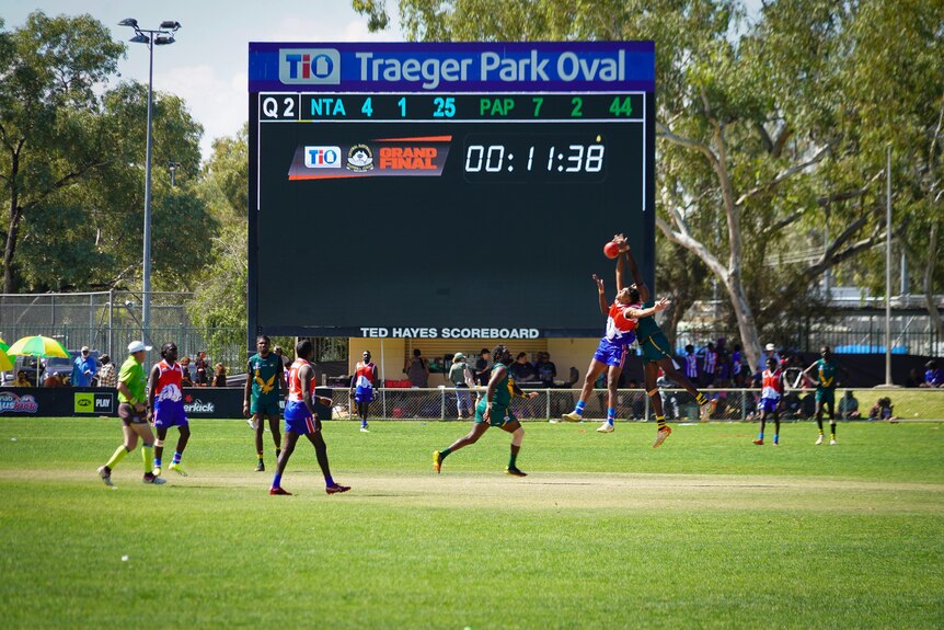 Men playing on a footy field