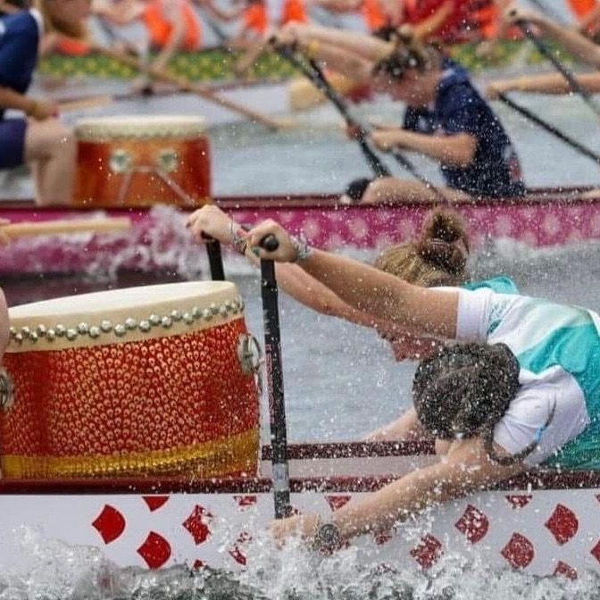 A person paddling a dragon boat