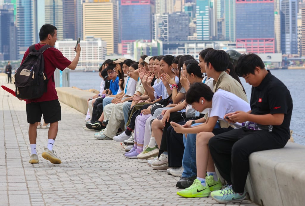 Onlookers claim their spot as they look out for the Shandong at West Kowloon Cultural Area waterfront. Photo: Jelly Tse