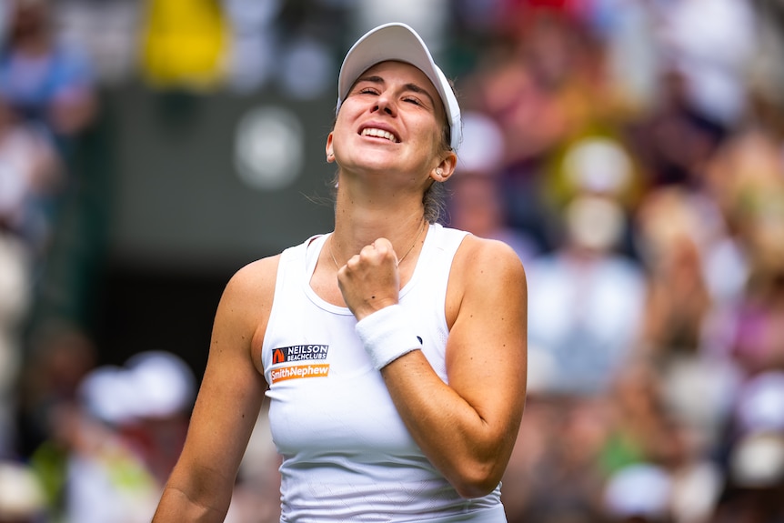 Belinda Bencic pumps her left fist in celebration