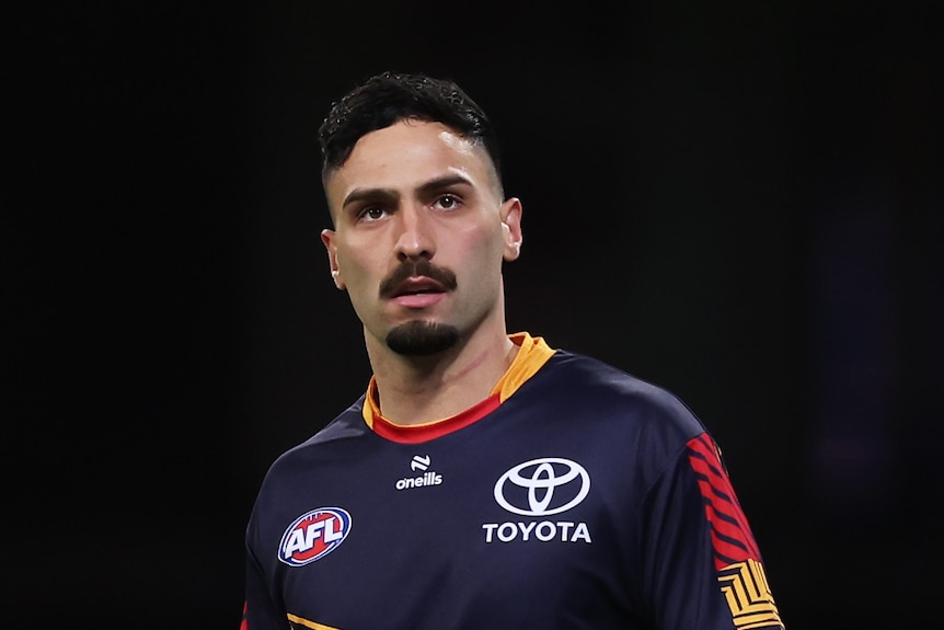 Izak Rankine of the Crows prepares before a game.