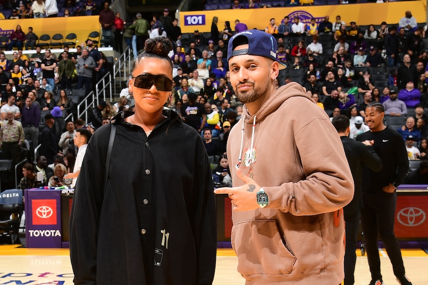 Nick Kyrgios poses with Naomi Osaka