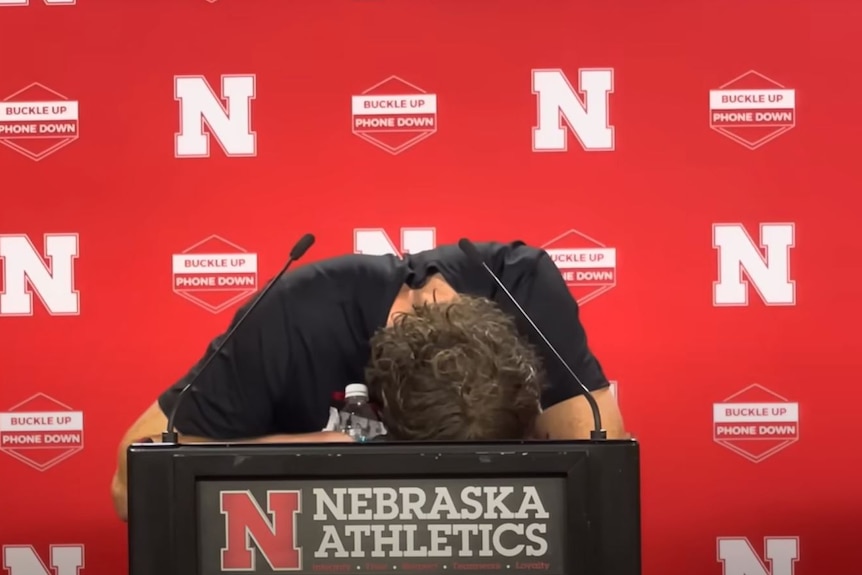 Archie Wilson crying during a press conference for University of Nebraska.