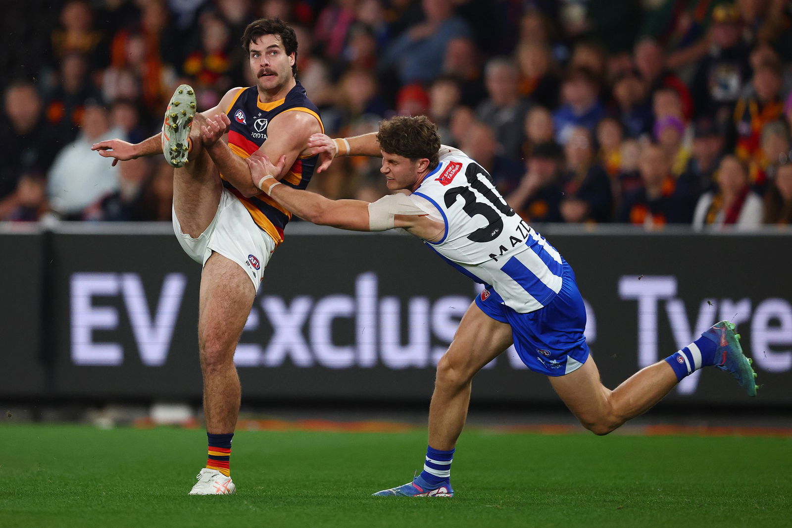 Darcy Fogarty of the Crows kicks the ball during the round 24 AFL match between North Melbourne Kangaroos and Adelaide Crows at Docklands on August 23, 2025 in Melbourne, Australia.