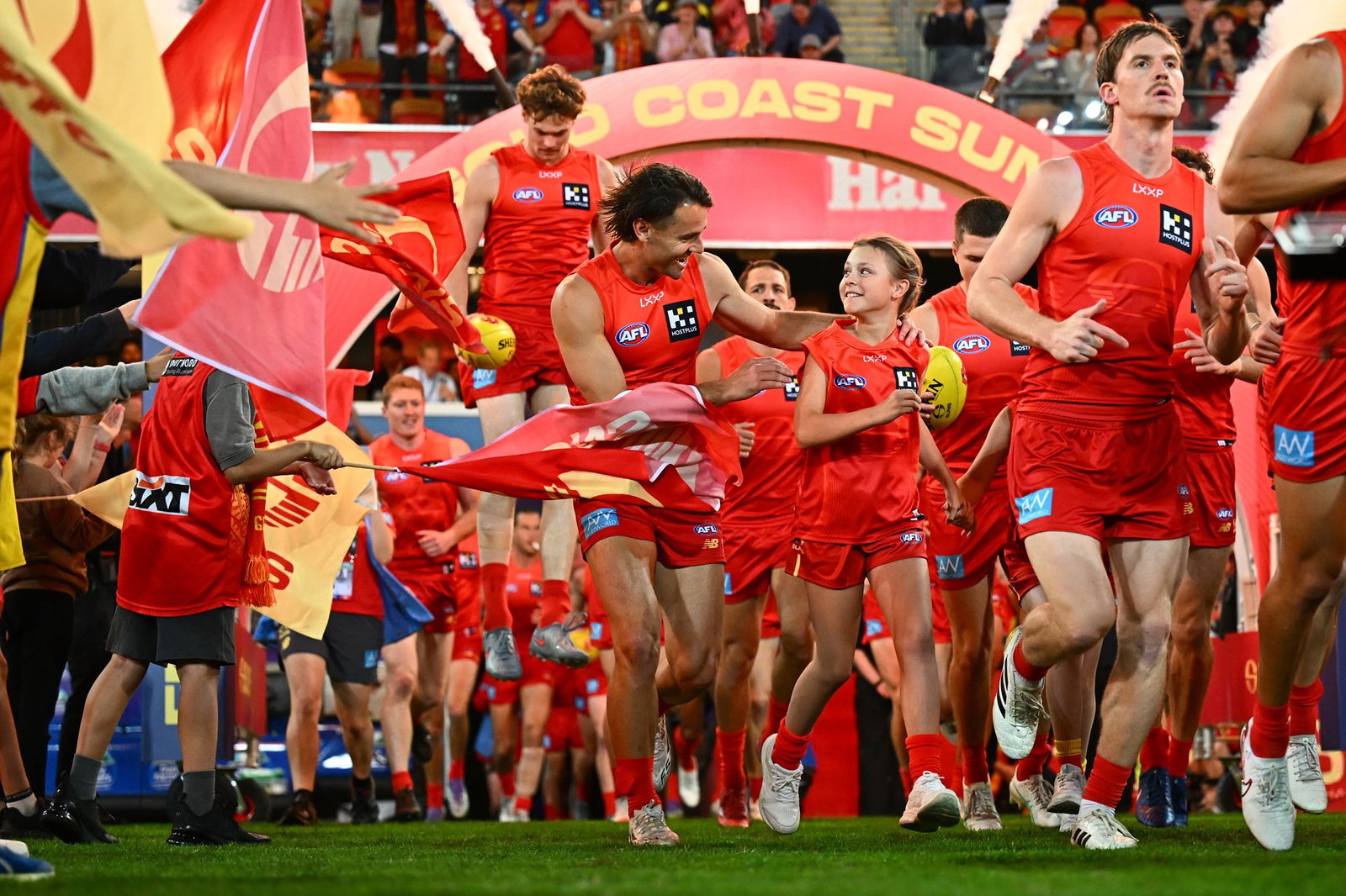 Suns players take to the field during the 2025 AFL Round 24 match between the Gold Coast Suns and the Essendon Bombers at Carrara on August 27, 2025 in Gold Coast, Australia.