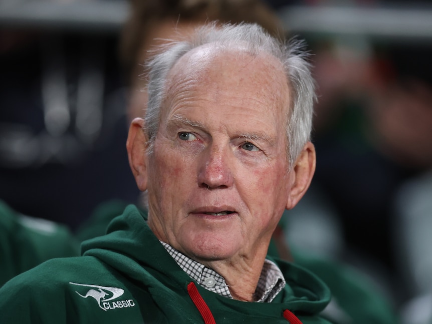 South Sydney NRL coach Wayne Bennett looks sideways in the box during a game.