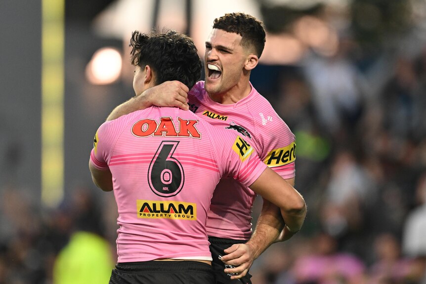 Nathan Cleary hugs Blaize Talagi following a match-winning try