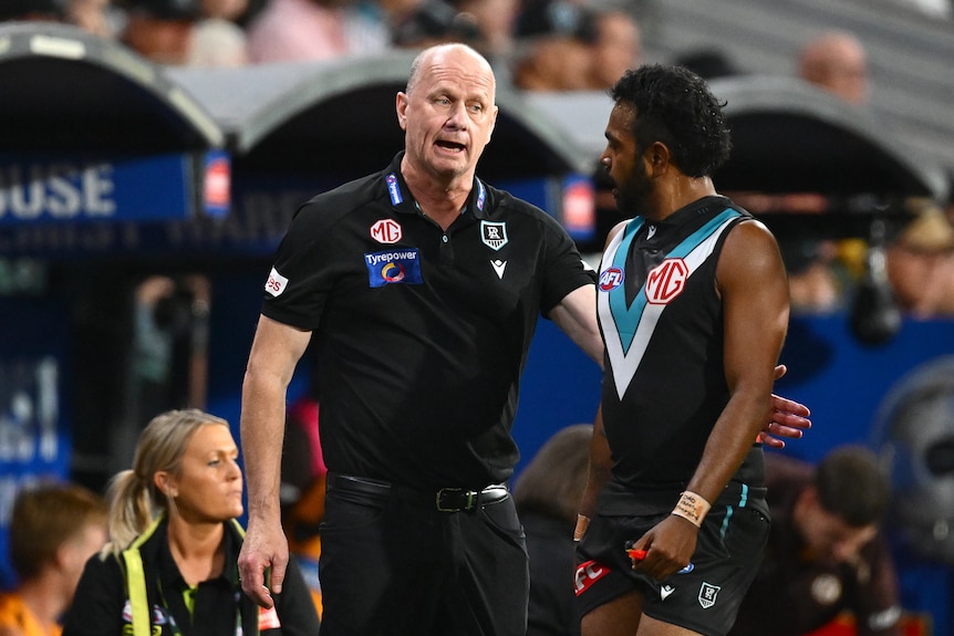 Ken Hinkley talks to Willie Rioli