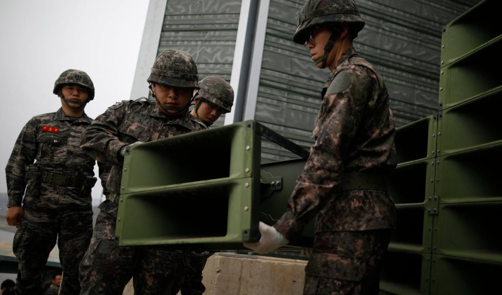 South Korean soldiers dismantle loudspeakers that were set up for propaganda broadcasts near the demilitarised zone separating the two Koreas in Paju. Photo: AFP