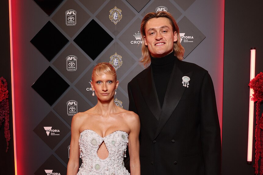 Magpies captain Darcy Moore and partner Triple J Presenter Dee Salmin. 