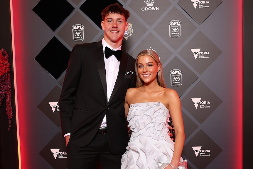 Connor O’Sullivan and partner Libby Cliffordn in a white ruffled gown