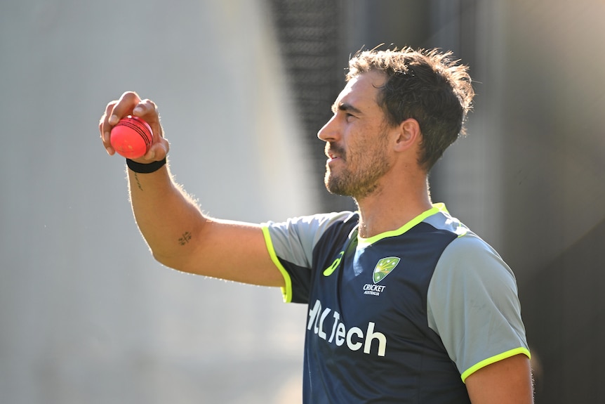 Mitchell Starc during an Australian team training session, holding a cricket ball in his right hand