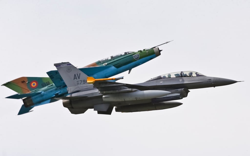 A Russian made MiG 21 fighter jet manoeuvres next to a US Air Force F-16 during a military exercise in Romania in 2014. Photo: AP A Russian made MiG 21 fighter jet manoeuvres next to a US Air Force F-16 during a military exercise in Romania in 2014. Photo: AP