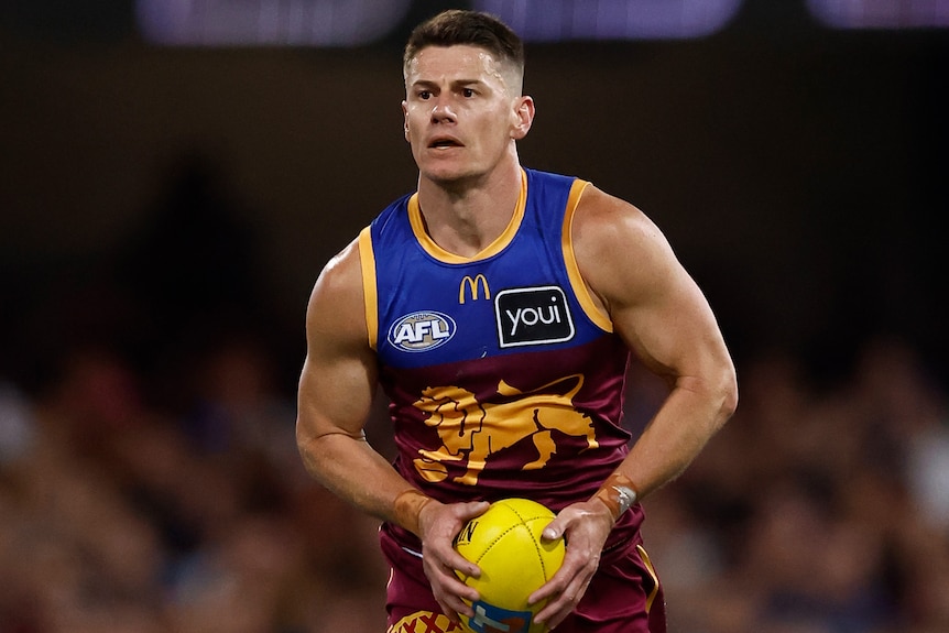 Dayne Zorko running the ball for the Lions.