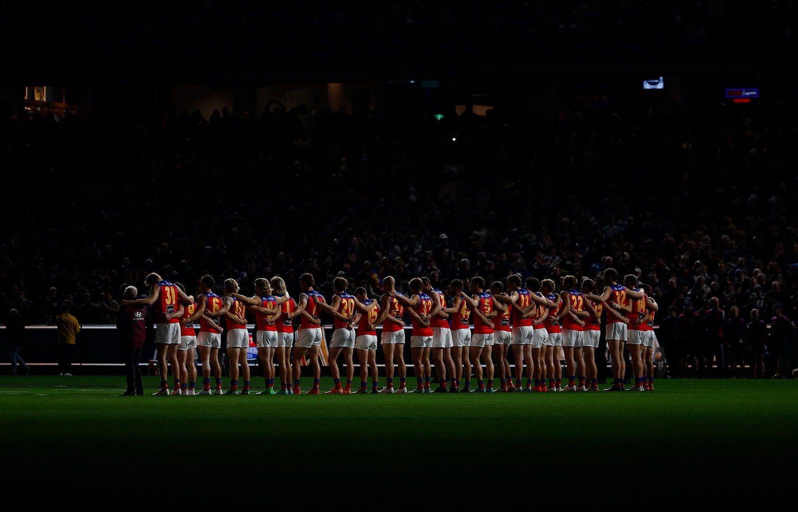 Brisbane players line up for the national anthem before the qualifying final against Geelong at the MCG.