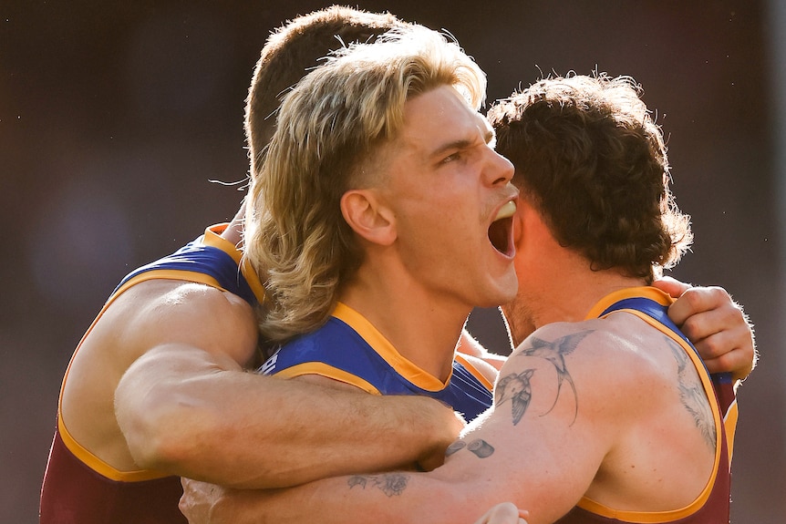 Will Ashcroft embraced by teammates