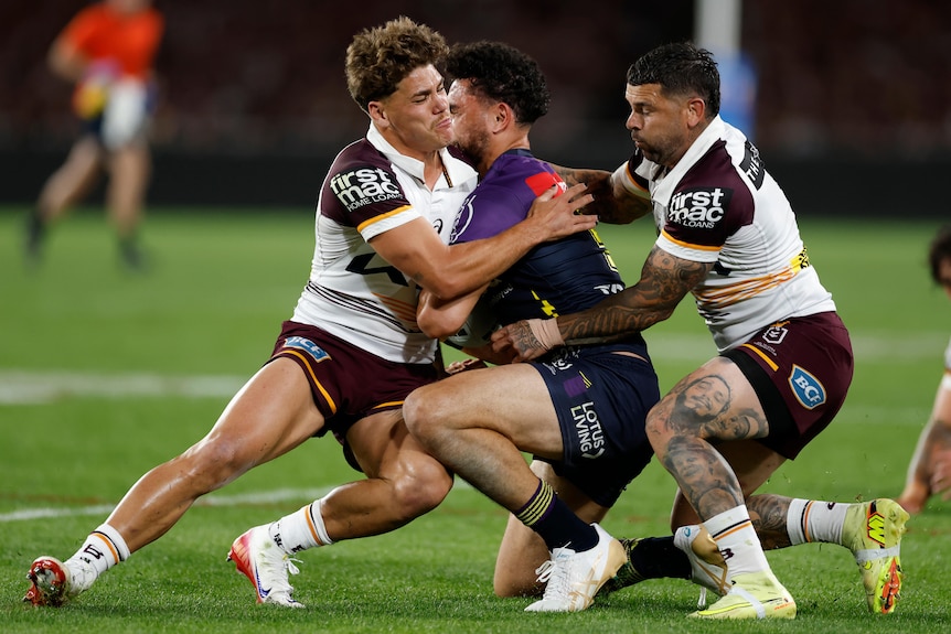 Reece Walsh collects Xavier Coates in the head with a tackle