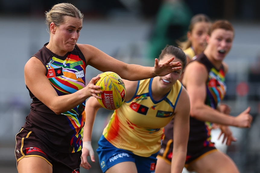 Greta Brodey prepares to kick the ball for the Hawks in their AFLW match against the Suns.
