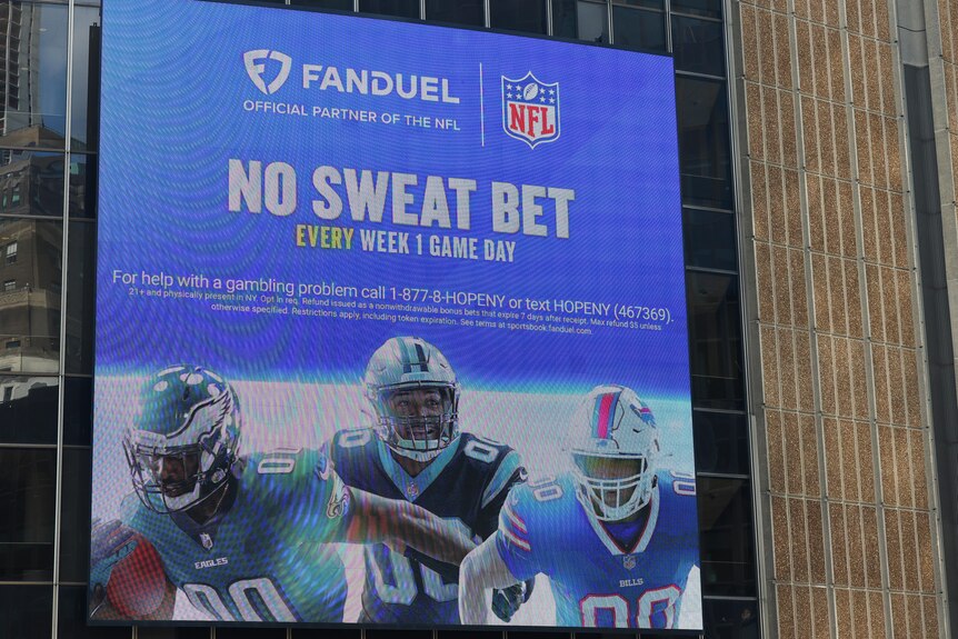A picture of a Fanduel and NFL betting billboard