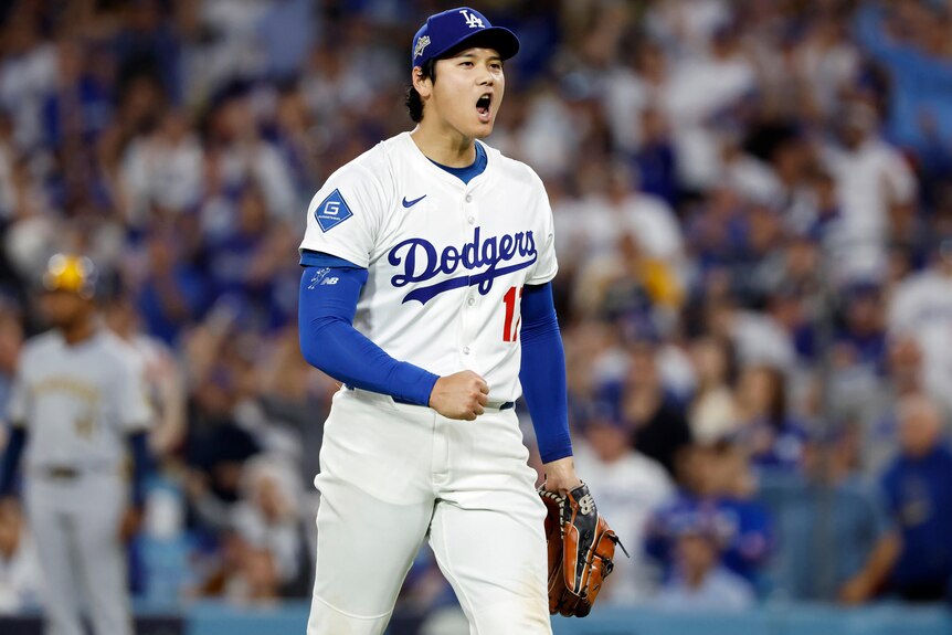 Shohei Ohtani celebrates during NLCS Game 4 against Brewers.