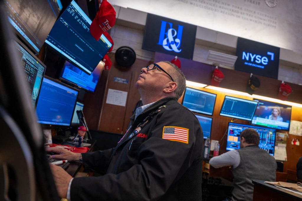 Traders work on the floor of the New York Stock Exchange on Wednesday. Photo: AFP