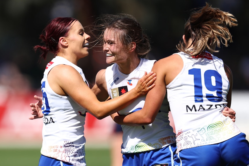 Ash Riddell of the Kangaroos celebrates a goal.