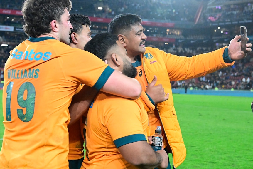 Wallabies players take a selfie after defeating Springboks.