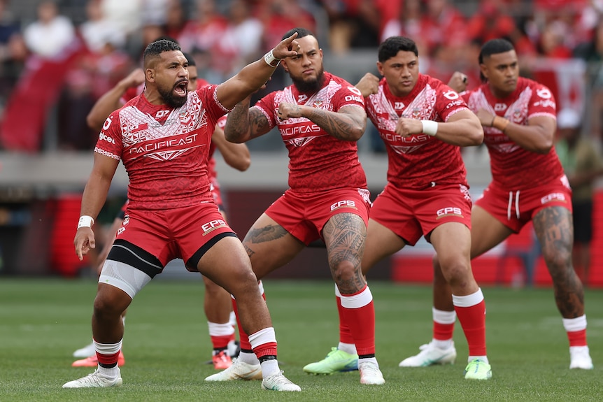  A man performs a war dance before a rugby league match
