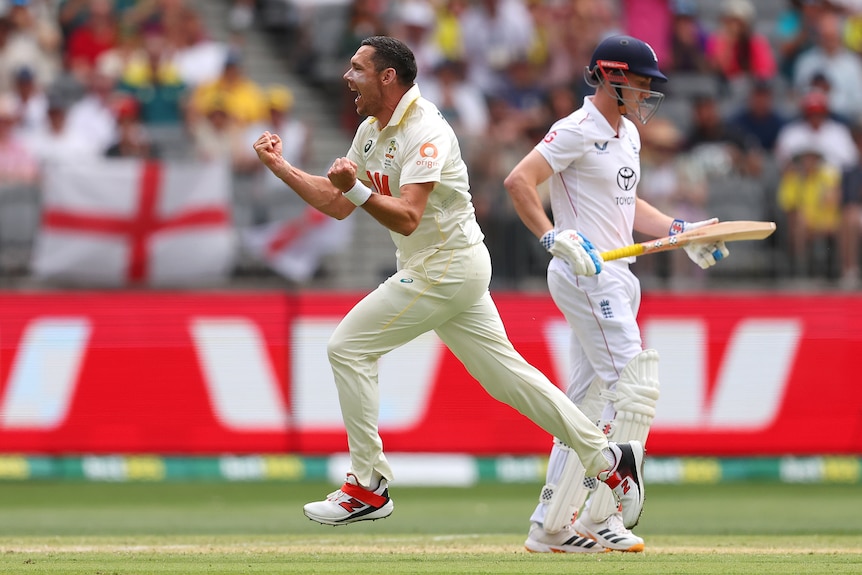 Scott Boland shouts as he runs past England batter Harry Brook.