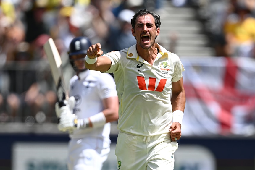 Mitchell Starc celebrates a wicket as an England batter watches